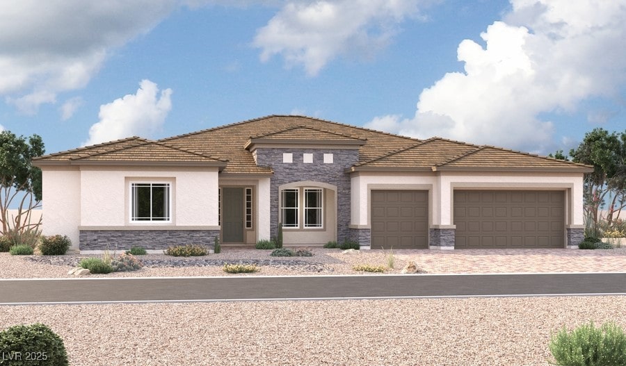 view of front of property with stucco siding, stone siding, driveway, and an attached garage