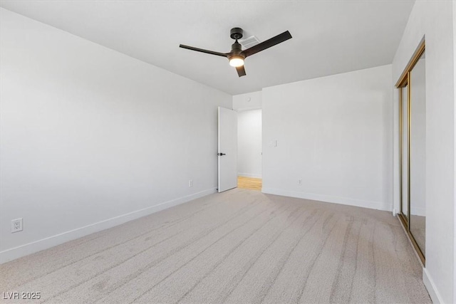 unfurnished bedroom with visible vents, ceiling fan, baseboards, carpet floors, and a closet
