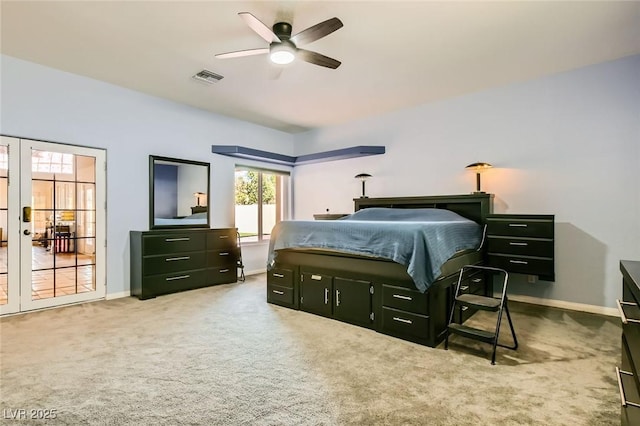 carpeted bedroom with visible vents, french doors, a ceiling fan, and baseboards