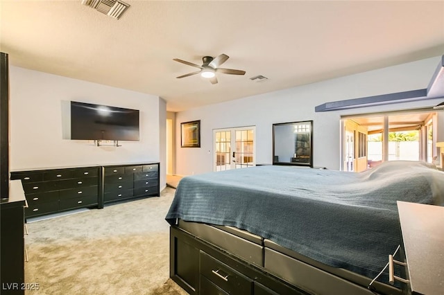 bedroom with light carpet, visible vents, a ceiling fan, and access to outside