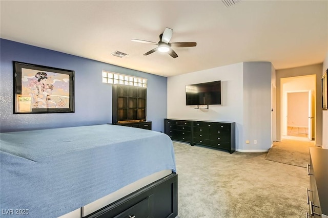 bedroom with baseboards, a ceiling fan, visible vents, and light carpet