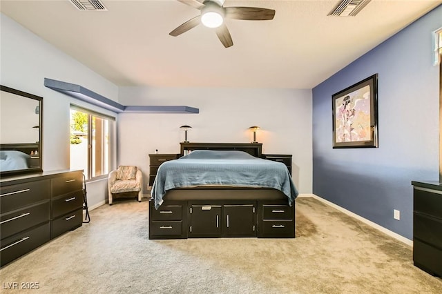 bedroom with visible vents, baseboards, light colored carpet, and a ceiling fan