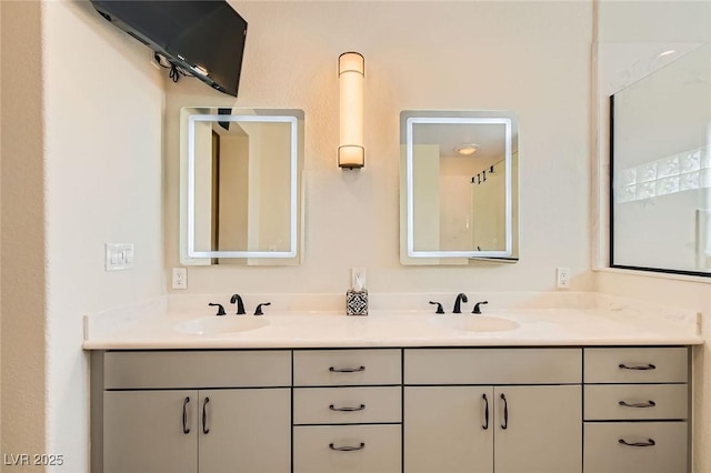 full bath with double vanity and a sink