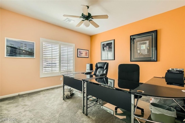 carpeted home office with visible vents, baseboards, and ceiling fan