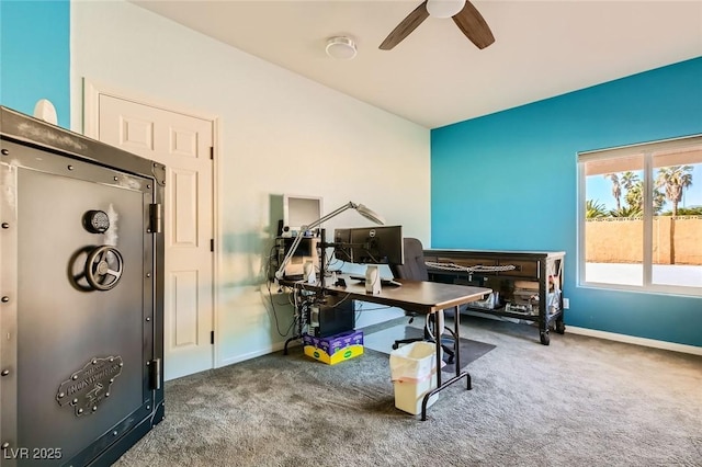 carpeted home office with baseboards and ceiling fan