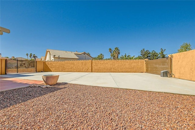 view of yard with fence and a gate