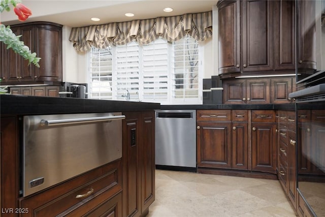 kitchen with stainless steel dishwasher, dark countertops, recessed lighting, and dark brown cabinetry