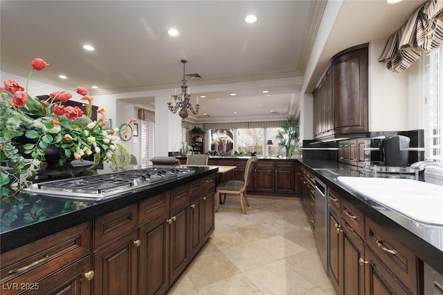 kitchen with visible vents, stainless steel appliances, dark brown cabinetry, crown molding, and a notable chandelier