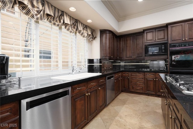 kitchen featuring a sink, decorative backsplash, dark brown cabinetry, appliances with stainless steel finishes, and crown molding