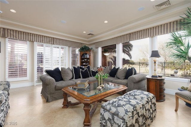 living area featuring visible vents, recessed lighting, baseboards, and ornamental molding