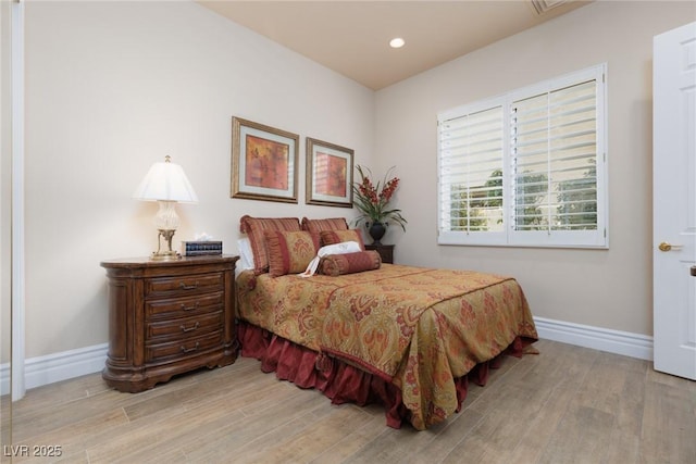 bedroom featuring recessed lighting, baseboards, and wood finished floors