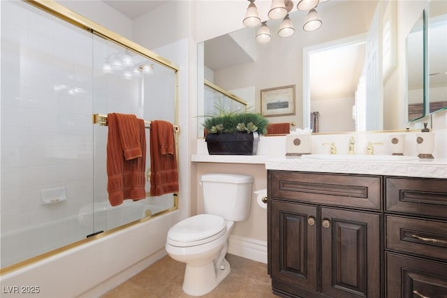 bathroom with a notable chandelier, toilet, tile patterned floors, combined bath / shower with glass door, and vanity