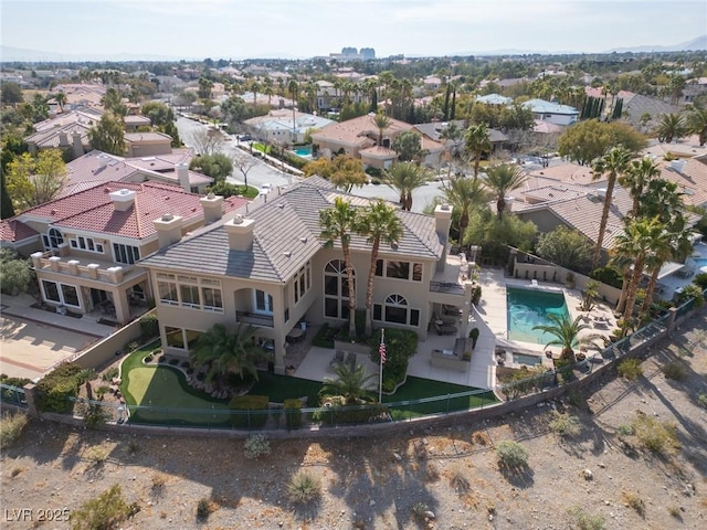 birds eye view of property with a residential view