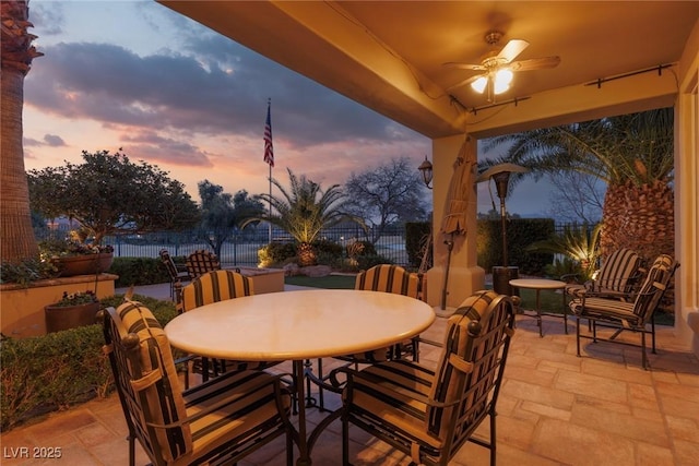 view of patio / terrace featuring a ceiling fan, outdoor dining area, and fence private yard