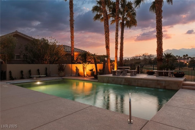 view of pool featuring a fenced in pool, a fenced backyard, and a patio area