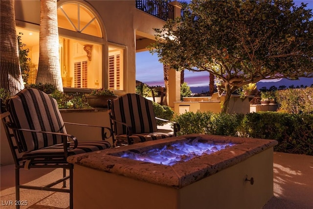 view of patio / terrace featuring a balcony and an outdoor hot tub