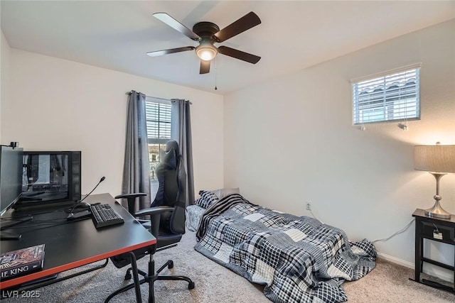 carpeted bedroom featuring ceiling fan and baseboards