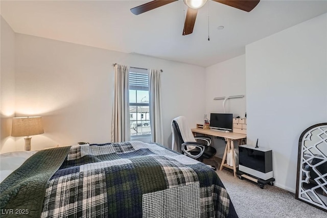 bedroom featuring baseboards, light carpet, and a ceiling fan