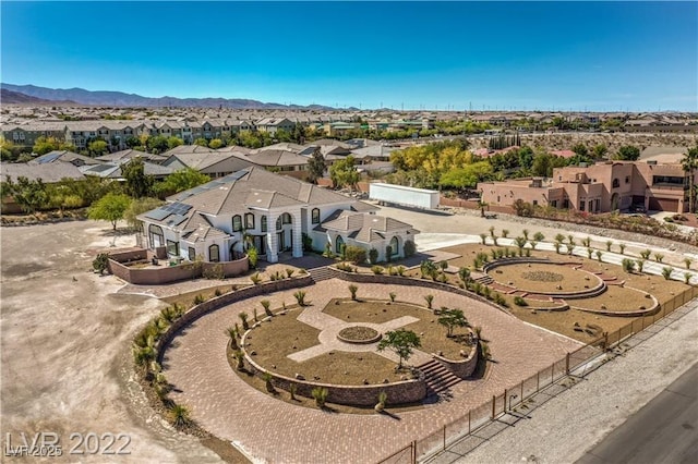 drone / aerial view with a mountain view and a residential view