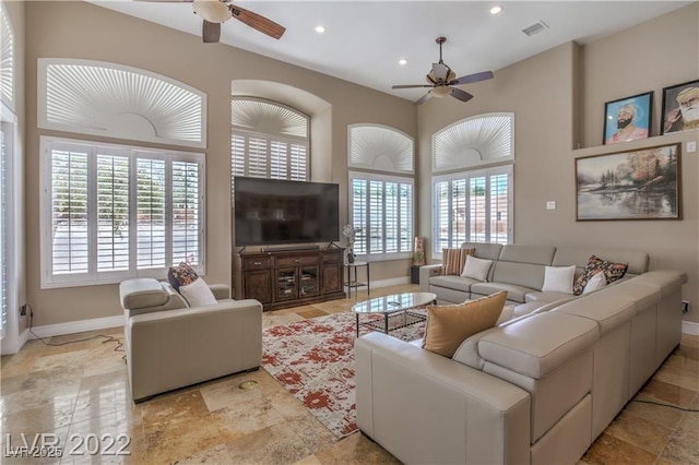 living area featuring recessed lighting, a ceiling fan, visible vents, and baseboards