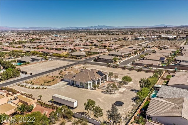 birds eye view of property featuring a mountain view and a residential view