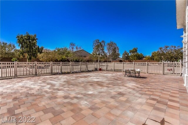 view of patio with outdoor dining space and fence