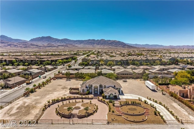 birds eye view of property with a mountain view and a residential view