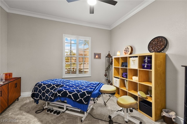 bedroom featuring ceiling fan, baseboards, carpet floors, and ornamental molding