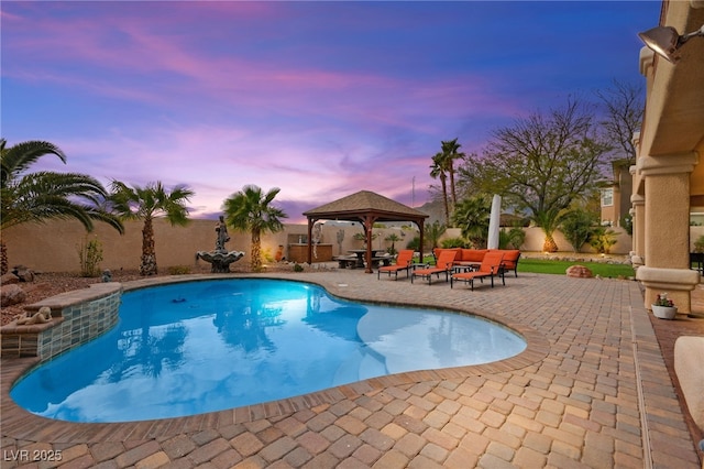 view of pool with a gazebo, a patio area, and fence