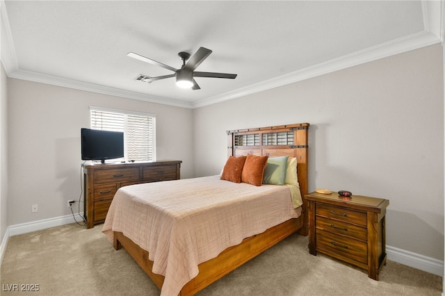 bedroom with visible vents, light carpet, ornamental molding, baseboards, and ceiling fan