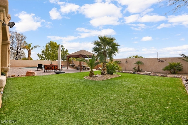 view of yard with a gazebo, fence private yard, and a patio area