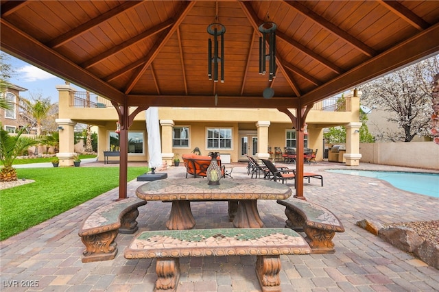 view of patio featuring a gazebo and an outdoor pool