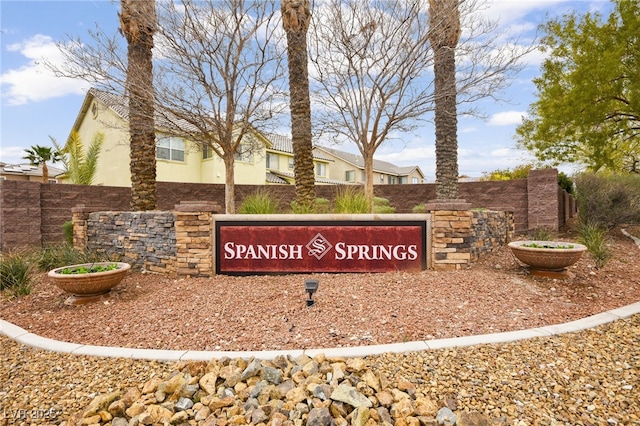 community sign featuring fence