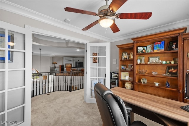 office featuring carpet floors, ceiling fan, and ornamental molding