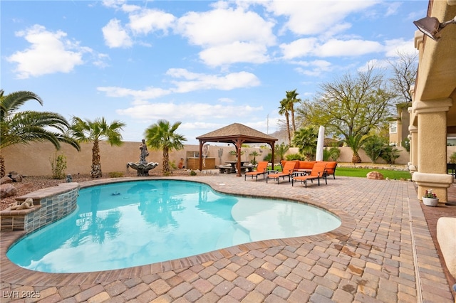 view of pool featuring a fenced in pool, fence, a gazebo, outdoor lounge area, and a patio area