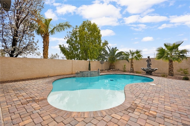 view of swimming pool featuring a fenced in pool, a patio, and a fenced backyard