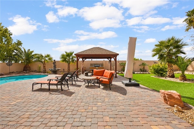 view of patio / terrace featuring a gazebo, a fenced in pool, and a fenced backyard