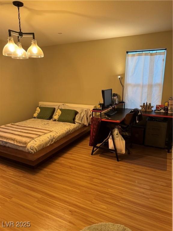 bedroom featuring light wood finished floors