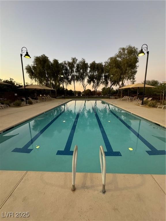 community pool featuring a patio area