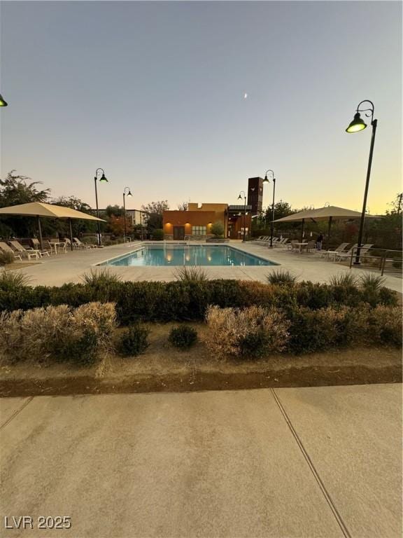 community pool with a patio area