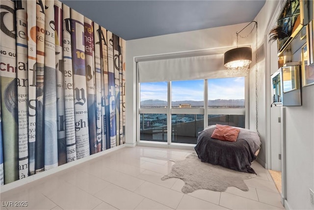 unfurnished bedroom featuring access to exterior and tile patterned flooring