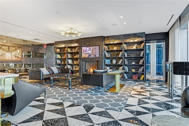 office area with recessed lighting, visible vents, and a chandelier