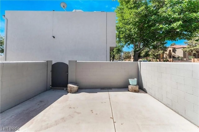 view of patio / terrace featuring a gate and fence