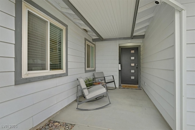 doorway to property featuring a porch