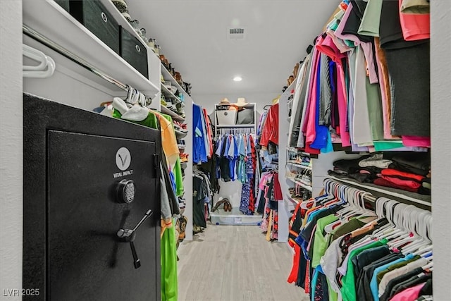 spacious closet featuring wood finished floors