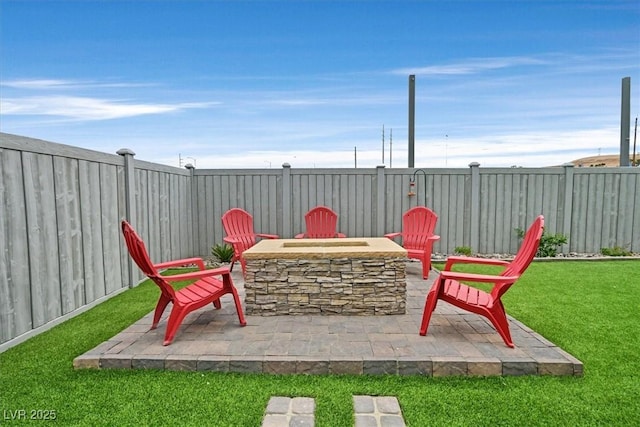 view of patio featuring a fire pit and a fenced backyard