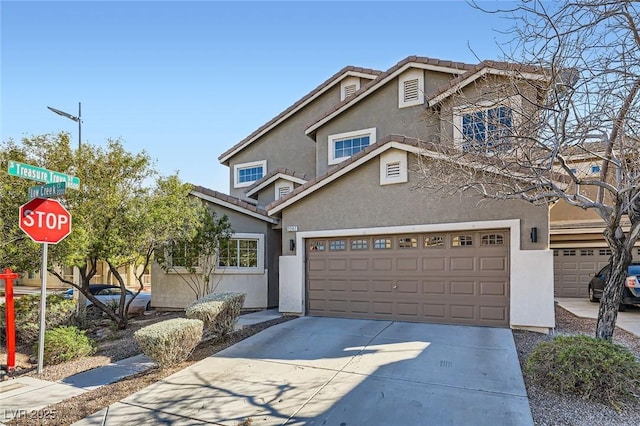 traditional-style home featuring stucco siding, concrete driveway, and a tile roof