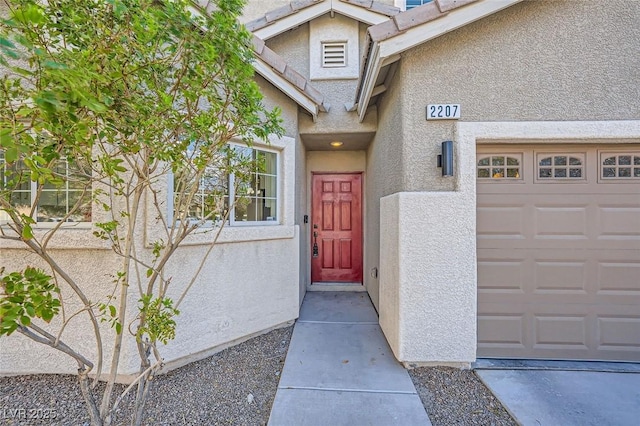 property entrance featuring stucco siding