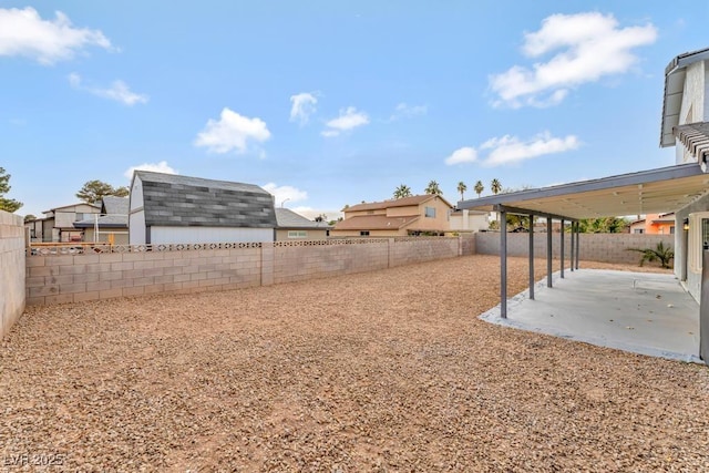 view of yard with a patio area and a fenced backyard