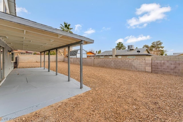 view of yard featuring a patio and a fenced backyard